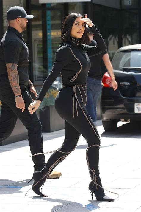 Kim Kardashian Dons Black Form Fitting Jumpsuit While Out To Lunch At Cafe Gratitude In Los Angeles