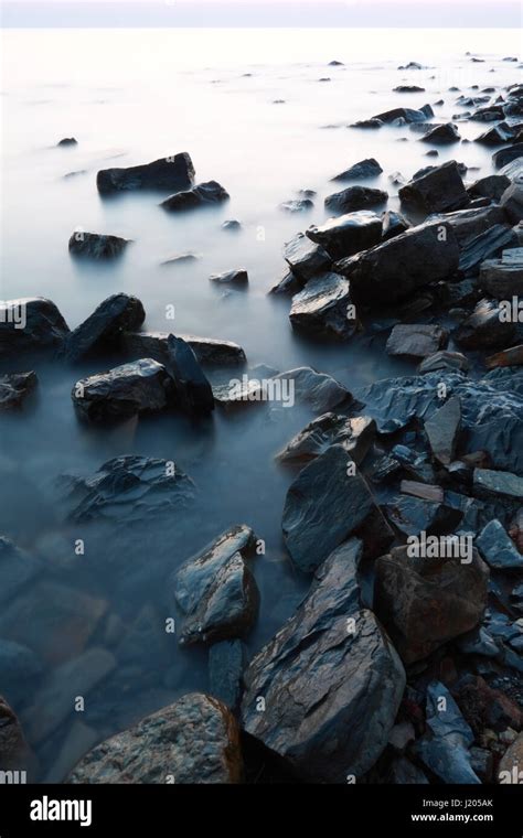 A Scenery Of The Black Sea Coast With Massive Stones And Calm Water