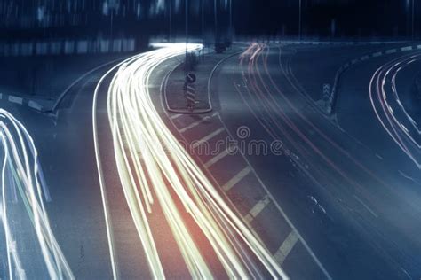 Long Exposure Photo Of Traffic With Blurred Traces From Cars Stock