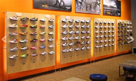 Shoes are out of the box and become wall art with this modern metal shoe rack; Shoe Wall Displays | Shoe wall, Shoe display, Shoe store ...