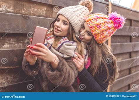 Two Pretty Girl Are Taking Selfie With Smartphone Stock Image Image