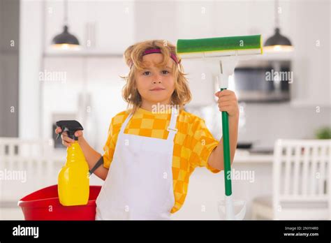 Child Use Duster And Gloves For Cleaning Funny Child Mopping House