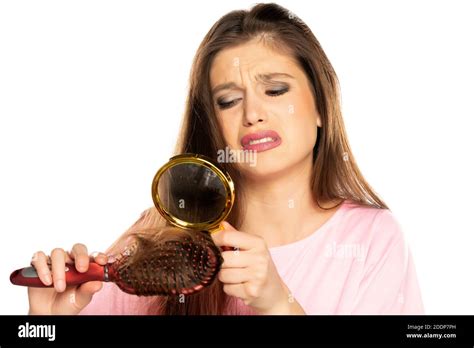 Portrait Of Young Nervous Woman Looking Her Hair With Magnifying Glass