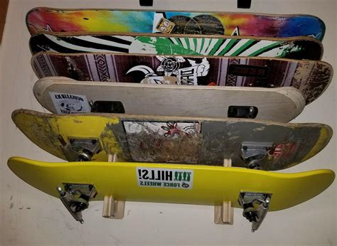 When mounting vertically with one mount the board just barely touches the wall at the bottom. Skateboard deck wall mount display rack holds 8