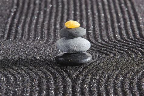 Japanese Zen Garden With Yin Yang Stone In Textured Sand Stock Photo
