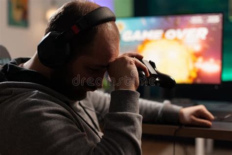 Sad Gamer Losing Video Games After Playing With Controller Stock Photo