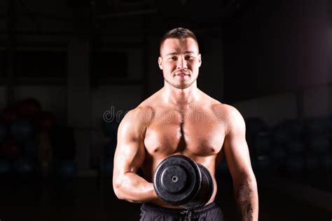 Muscular Man Working Out In Gym Doing Exercises With Dumbbells At Biceps Strong Male Naked