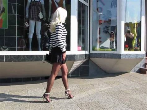 Walking In Town In Short Skirt High Heels And Black