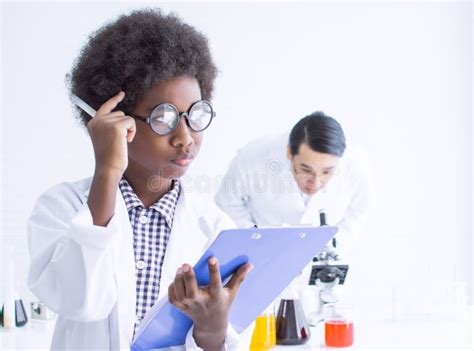 African Black Boy Studying Science In Classroom At School Stock Photo