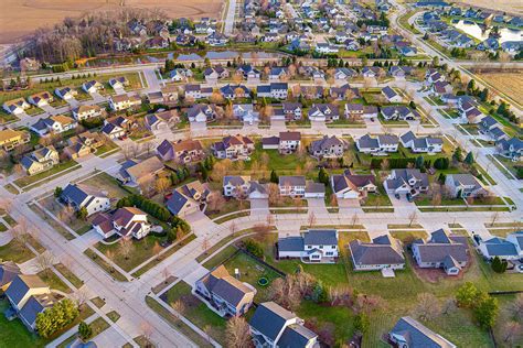 Flying Above Beautiful Suburb Neighborhood On A Springtime Morning