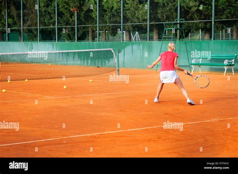 Girl Playing Tennis Outdoor On Court Stock Photo Alamy