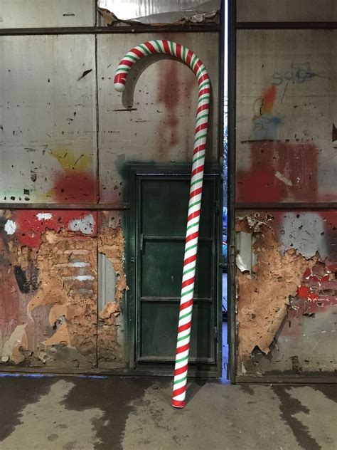 They're easy to make and with a little work and spraypaint you'll have some large canes to turn your entrance into a bit of candy wonderland. Secondhand Prop Shop | Christmas | Giant Candy Canes