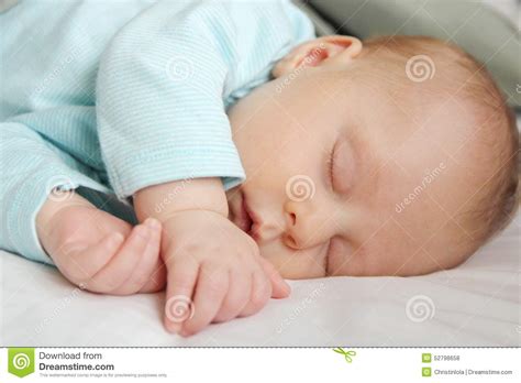 Peaceful Sleeping Newborn Infant Stock Photo Image Of Hands Cuddled
