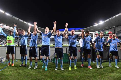And while it may be crazy, chaotic and in flux, it's ours. Sydney FC players celebrate their A-League semi-final win ...