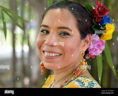 Portrait Of Woman In Traditional Dress Smiling At Camera Hi Res Stock