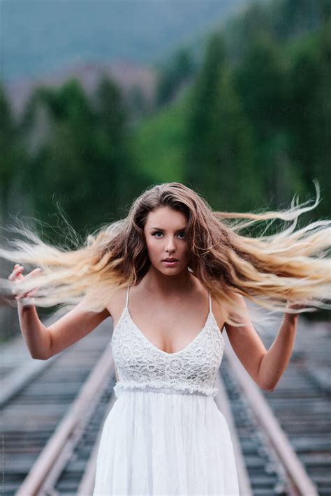 Woman Flipping Her Hair Long Blond Hair Del Colaborador De Stocksy