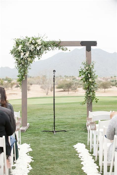 Modern Wooden Wedding Arch With White Flowers And Greenery Wedding