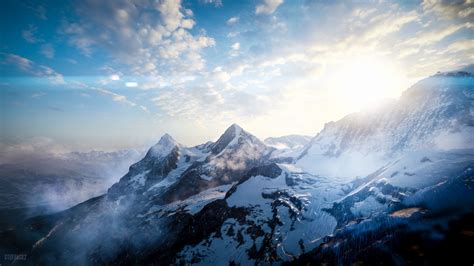 Mountains Peaks Sky Snowy View From Above Sunlight 4k Hd Wallpaper