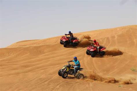 Dubai Desert Quad Bike Safari Camel Ride Sand Surf And Bbq Getyourguide