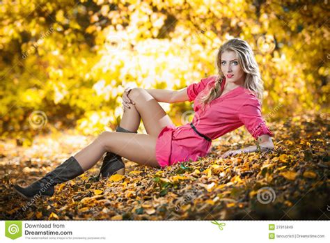 Beautiful Woman With Long Legs In Autumn Park Stock Image