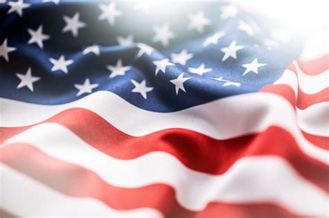 What secrets, myths and facts surround him is divided by american butler. USA flag. American flag. American flag blowing wind. Close ...