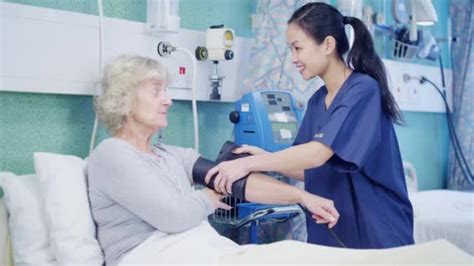 Doctor And Nurse Chatting With Patient — Stock Video © Hotelfoxtrot