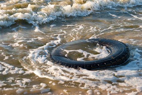 Best Pollution Tire Beach Nature Stock Photos Pictures And Royalty Free