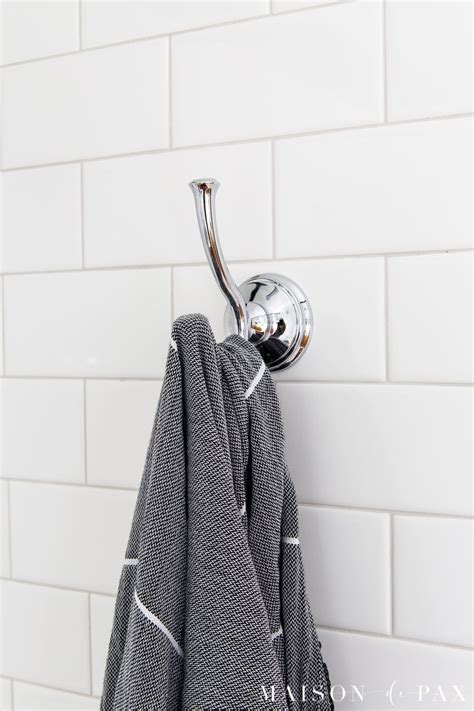 Learn how to drill through tile to hang mirrors, towel hooks, and more! How to Drill into Tile to Hang Things - Maison de Pax