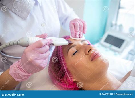 Girl At An Appointment With A Beautician Is Doing An Ultrasonic Face