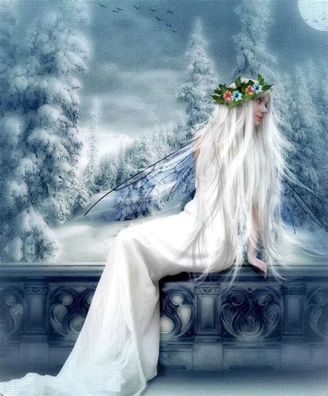 A White Fairy Sitting On Top Of A Car In Front Of Snow Covered Trees