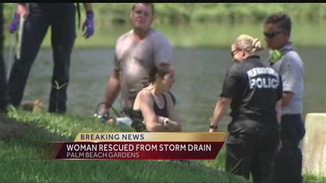 barely clothed woman rescued from storm drain