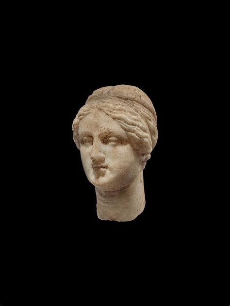 A Marble Head Of A Woman Perhaps A Goddess Hellenistic Or Early Roman