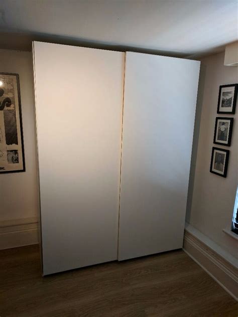 If i were doing it again, i would probably increase the spacing to 180cm, just to get with the bedding and sliding doors installed this is a little bit tight. 2 x Ikea PAX Double Wardrobe White, Hasvik Sliding Doors ...