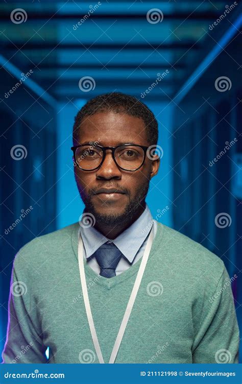 Portrait Of African American It Specialist In Server Room Stock Photo