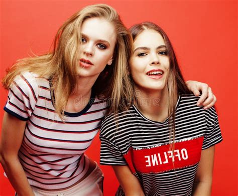 Two Best Friends Teenage Girls Together Having Fun Posing Emotional On Red Background Besties