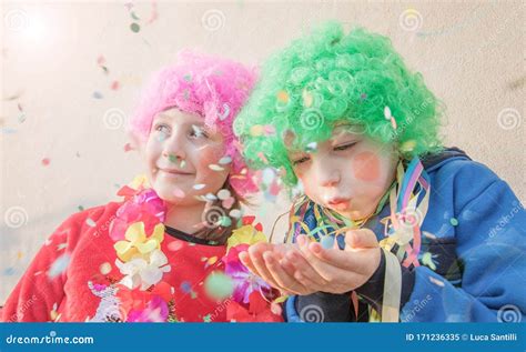 Children Girls Celebrate Carnival Smiling And Having Fun With Colorful