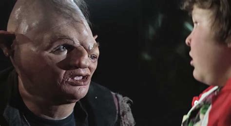 He has brown curly hair and blue eyes. The Sad, Real-Life Story of Sloth From 'The Goonies'