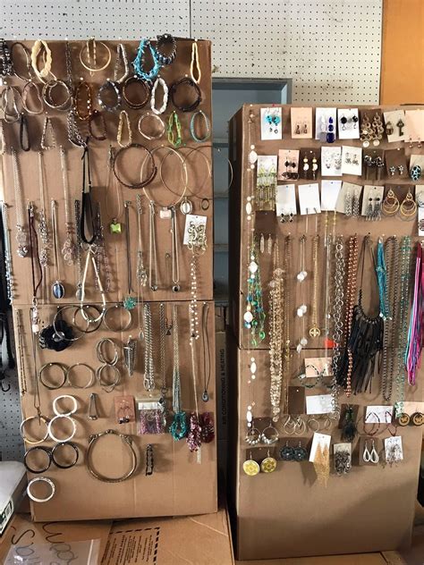 idea for displaying jewelry at a garage sale hang necklaces bracelets earrings and rings on