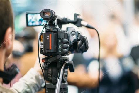 Journalist With Television Camera — Stock Photo © Microgen 115434544