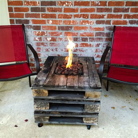 How to build a backyard fire pit. Gas fire pit built into a pallet table. Fire pit ideas ...