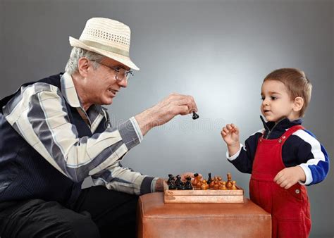 Grandfather And Grandson Playing Chess Stock Image Image Of Love