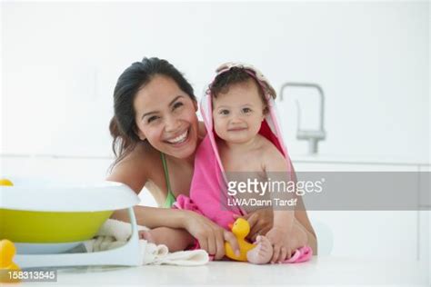 Hispanic Mother Drying Daughter After Bath High Res Stock Photo Getty