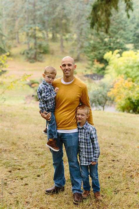 Dad Posed With Two Sons By Stocksy Contributor Leah Flores Stocksy