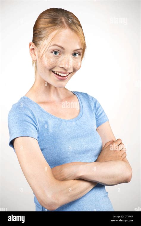Young Woman With Arms Folded Portrait Stock Photo Alamy
