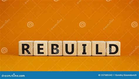 Rebuild And Build Symbol The Concept Word Rebuild On Wooden Cubes