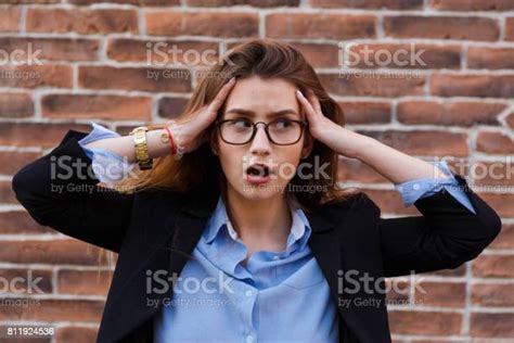 Frustrated Business Woman Holding His Hands To Her Head In Frustration