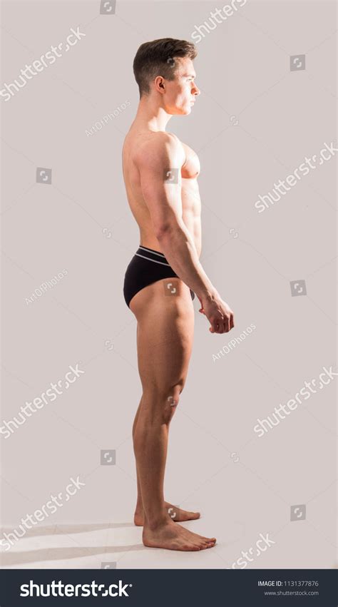 Side View Handsome Shirtless Muscular Man Stockfoto 1131377876