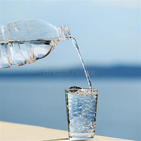 Water Pouring Into Glass From Bottle Stock Image Image Of Healthy