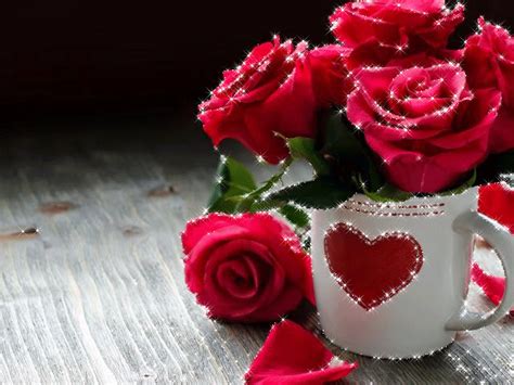 Some Red Roses In A White Mug With Hearts Painted On It And Water