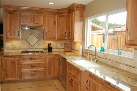 Finding the right kitchen cabinet brand for your kitchen. Custom designed kitchen with wood cabinets, tile backsplash, and granite countertops ...